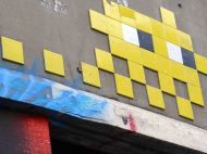 Invader piece half picked over by a scavenger