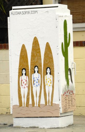three women with surfboards street art