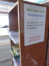 bookcase with sign: Inle Canoe Lady Mini Book Shelf