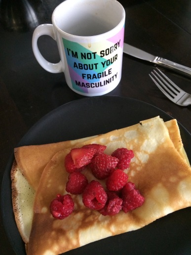 mug: "I'm not sorry about your fragile masculinity" - with raspberry crepes