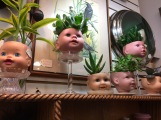 creepy dollhead planters