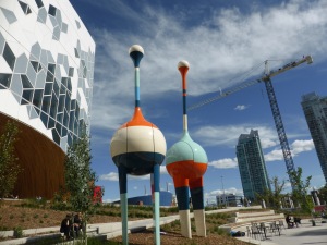 side of modern building with big colourful sculpture