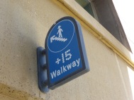 +15 walkway with icon of person wearing cowboy hat